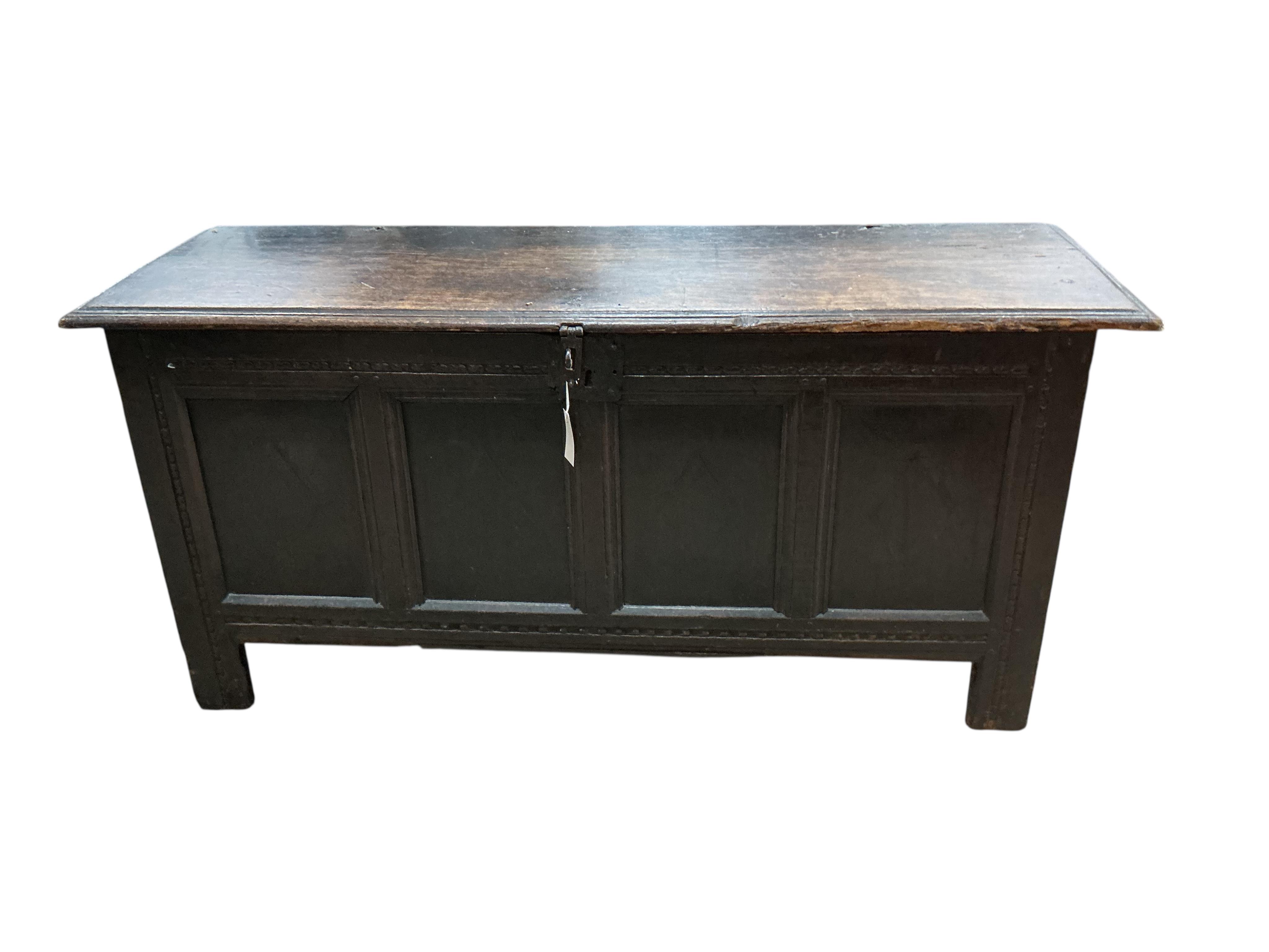 An 18th century panelled oak coffer, width 138cm, depth 46cm, height 64cm